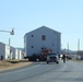 Continuing making history: Contractors move last two World War II-era barracks to new locations