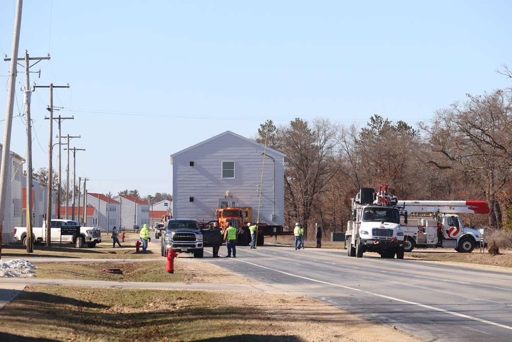 Continuing making history: Contractors move last two World War II-era barracks to new locations