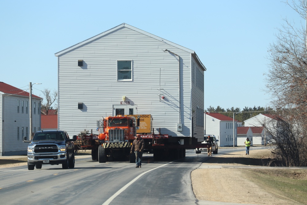 Continuing making history: Contractors move last two World War II-era barracks to new locations