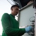 U.S. Navy Sailor Cleans An Engine Data Collection Board