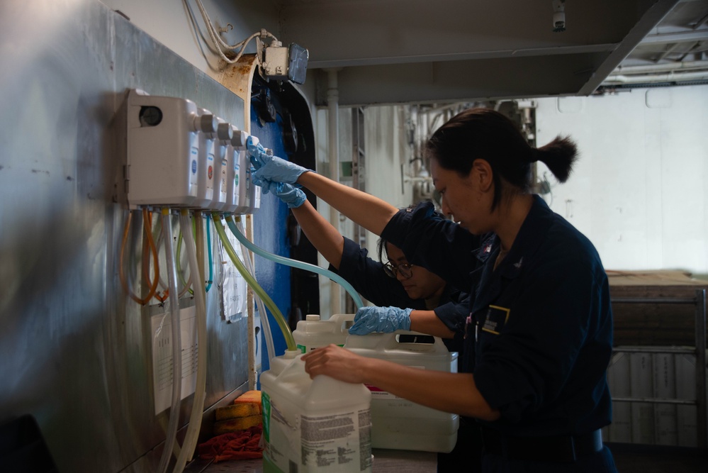 U.S. Navy Sailor Refills Cleaning Supplies