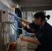 U.S. Navy Sailor Refills Cleaning Supplies