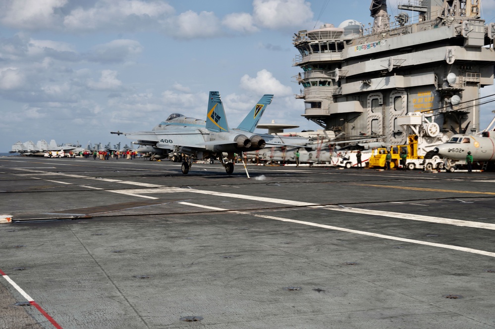 An F/A-18E Super Hornet Makes An Arrested Landing On The Flight Deck