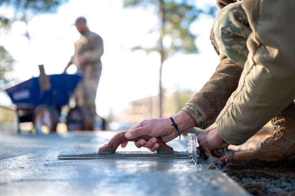 20th CES constructs fire pit for dorm community