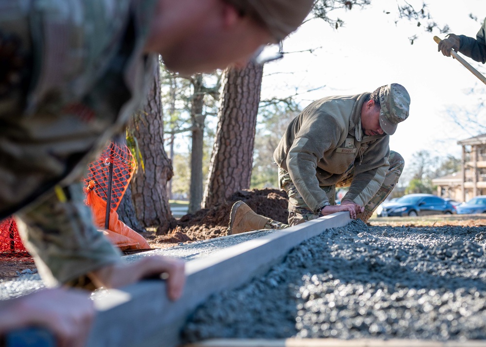 20th CES constructs fire pit for dorm community