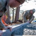 20th CES constructs fire pit for dorm community