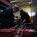 Vehicle Maintenance Removes A Fire Truck Engine