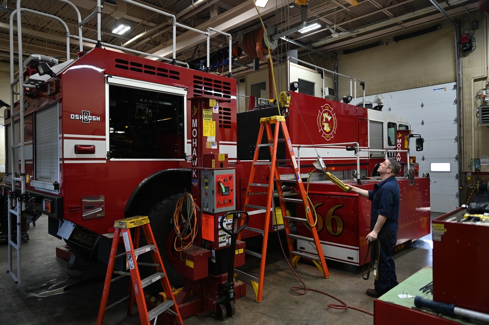 Vehicle Maintenance Removes A Fire Truck Engine