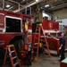 Vehicle Maintenance Removes A Fire Truck Engine