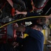 Vehicle Maintenance Removes A Fire Truck Engine