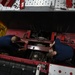 Vehicle Maintenance Removes A Fire Truck Engine