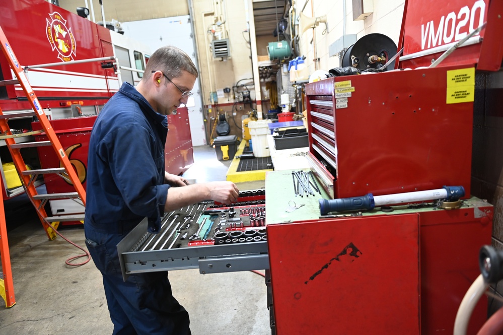 Vehicle Maintenance Removes A Fire Truck Engine