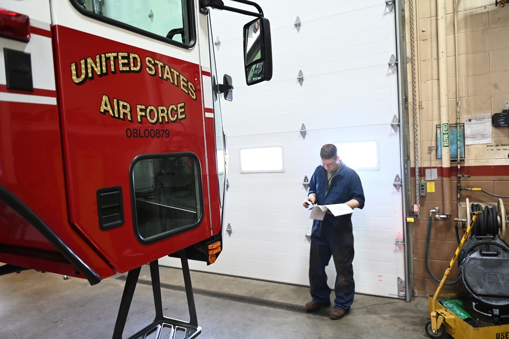 Vehicle Maintenance Removes A Fire Truck Engine