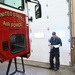 Vehicle Maintenance Removes A Fire Truck Engine