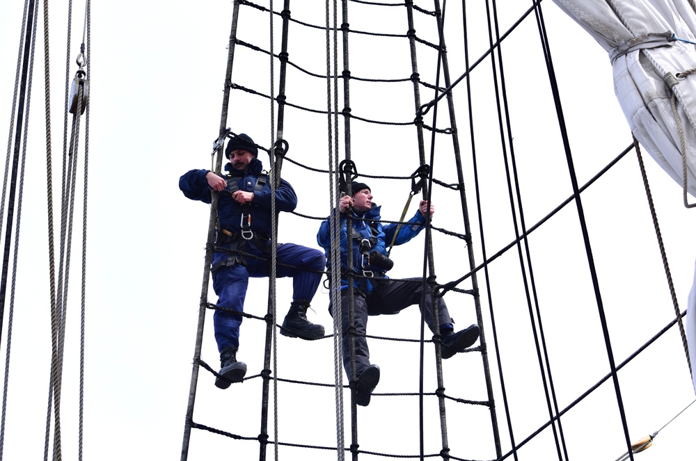 USCGC Eagle personnel conduct maintenance on training vessel’s rigging, sails