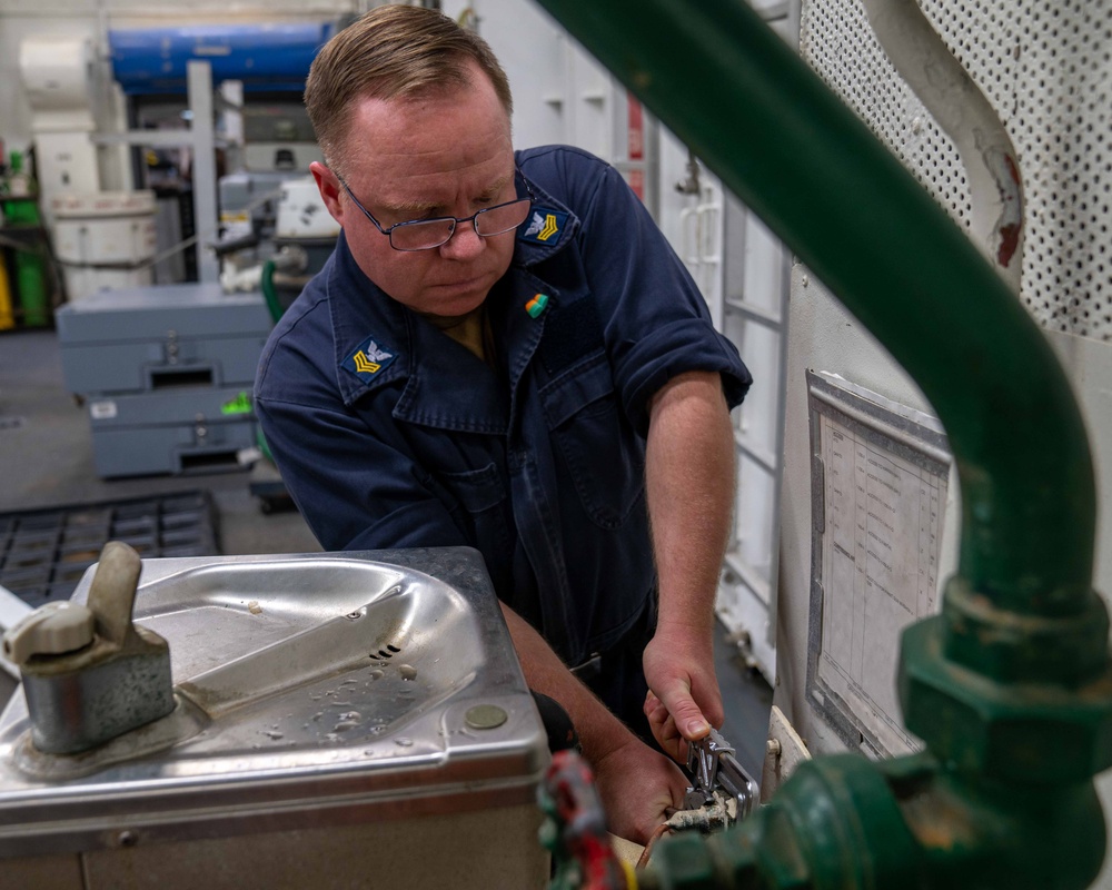 Sailor preforms maintenance aboard USS Carl Vinson