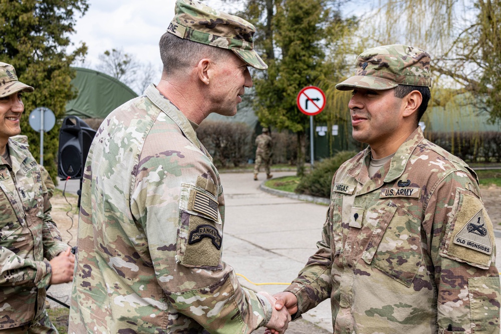 IVY 6 Gives coins to outstanding soldiers from the Combat Aviation Brigade