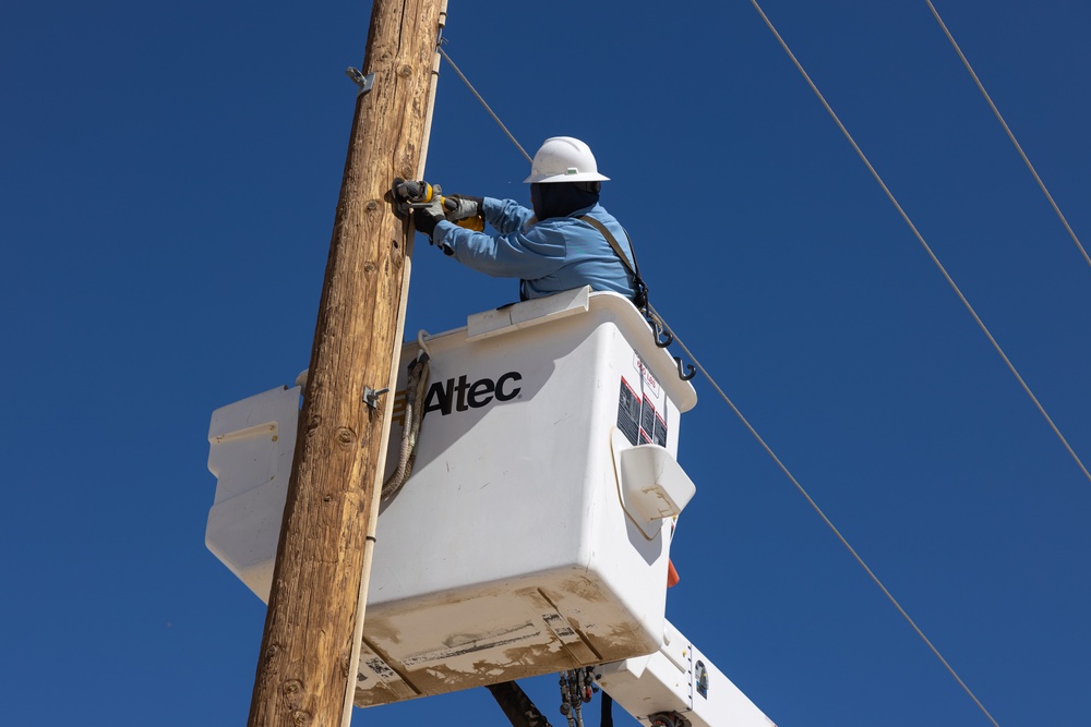 Public Works Division repairs powerlines at The Combat Center during windstorm