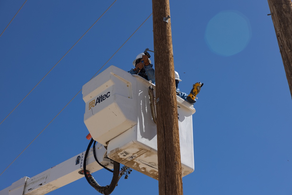 Public Works Division repairs powerlines at The Combat Center during windstorm