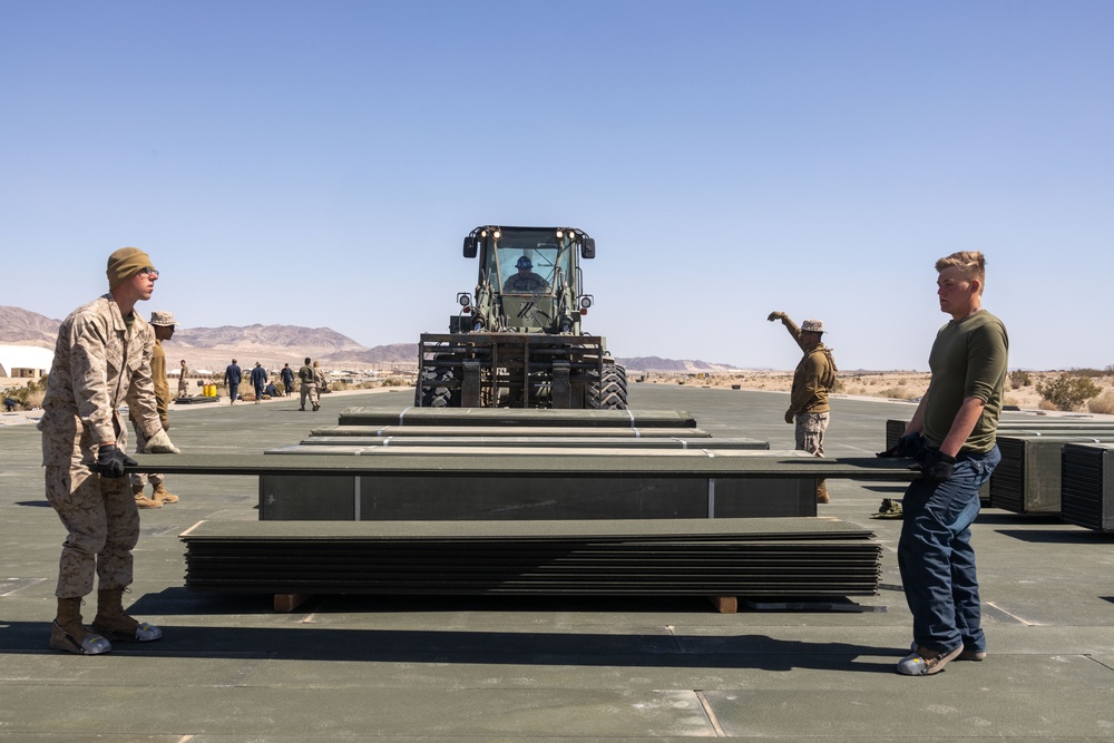 Marines lay down first Prefabricated Surfaced Aluminum Flat Top Reinforced Trackway