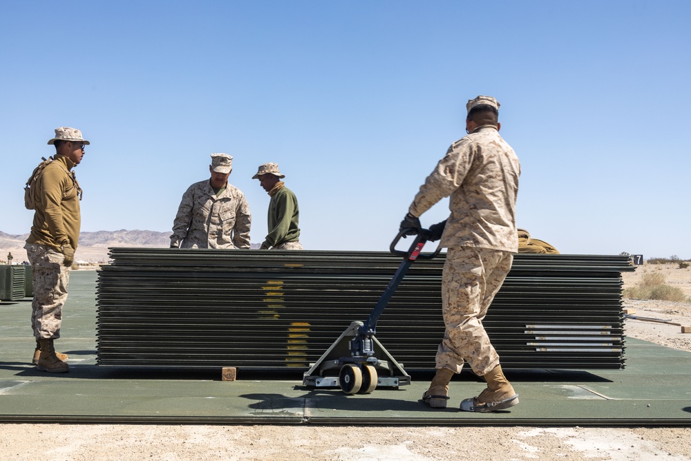 Marines lay down first Prefabricated Surfaced Aluminum Flat Top Reinforced Trackway