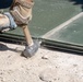 Marines lay down first Prefabricated Surfaced Aluminum Flat Top Reinforced Trackway