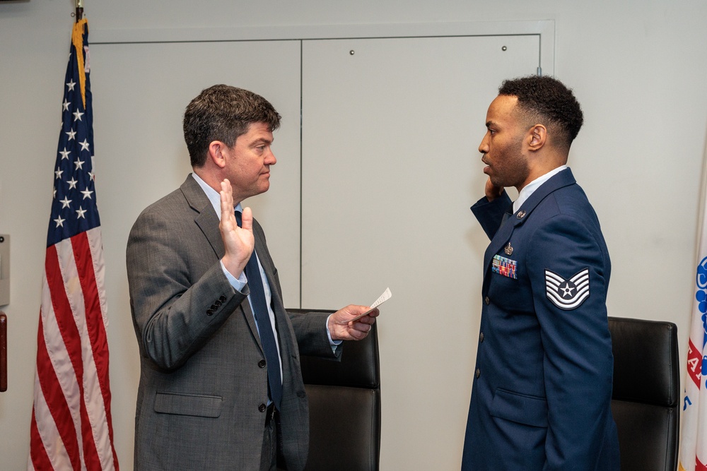 Exec Director Dr. Jude Sunderbruch promotes Air Force Tsg Brandon George to Msg