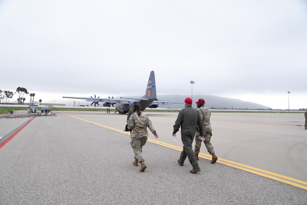 Stepping to the plane: Maj. Gen. Ondra Berry and Brig. Gen. Allison Miller take a training ride with a MAFFS Crew