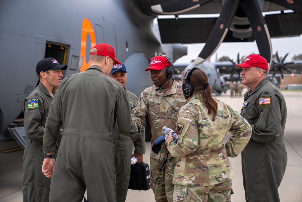 Brig. Gen. Allison Miller, Col. Evan Kirkwood, and Maj. Gen. Ondra Berry, talk with crews on the flightline during the 2023 Modular Airborne Fire Fighting System (MAFFS) Spring Training