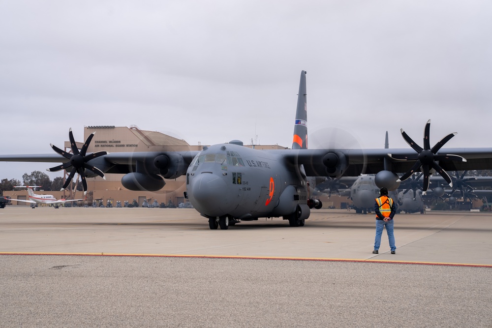 A C-130 from the Nevada Air National Guard's 152nd Airlift Wing taxis out to the runway at Channel Islands Air National Guard Station during the 2023 Modular Airborne Fire Fighting Systems (MAFFS) Spring Training on April 13, 2023
