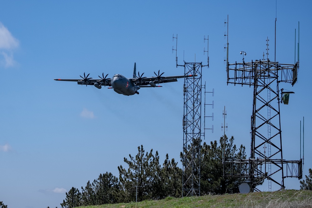 A C-130 (MAFFS 9) from Nevada Air National Guard's 152nd Airlift Wing passes by April 14, 2023, during Modular Airborne Fire Fighting System (MAFFS) Spring Training 2023