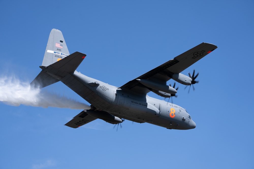 A C-130 (MAFFS 8) from Nevada Air National Guard's 152nd Airlift Wing performs a water drop April 14, 2023