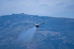 A C-130 (MAFFS 8) from Nevada Air National Guard's 152nd Airlift Wing performs a water drop April 14, 2023