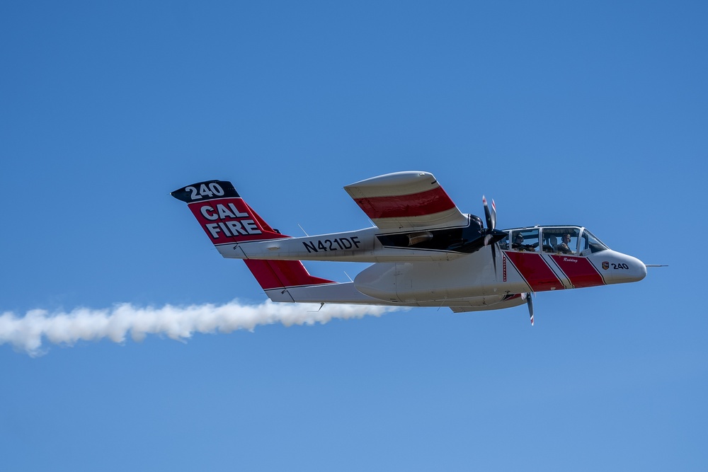 U.S. Forest Service Lead Plane dispenses a puff of smoke during Modular Airborne Fire Fighting System (MAFFS) Spring Training 2023 on April 14, 2023