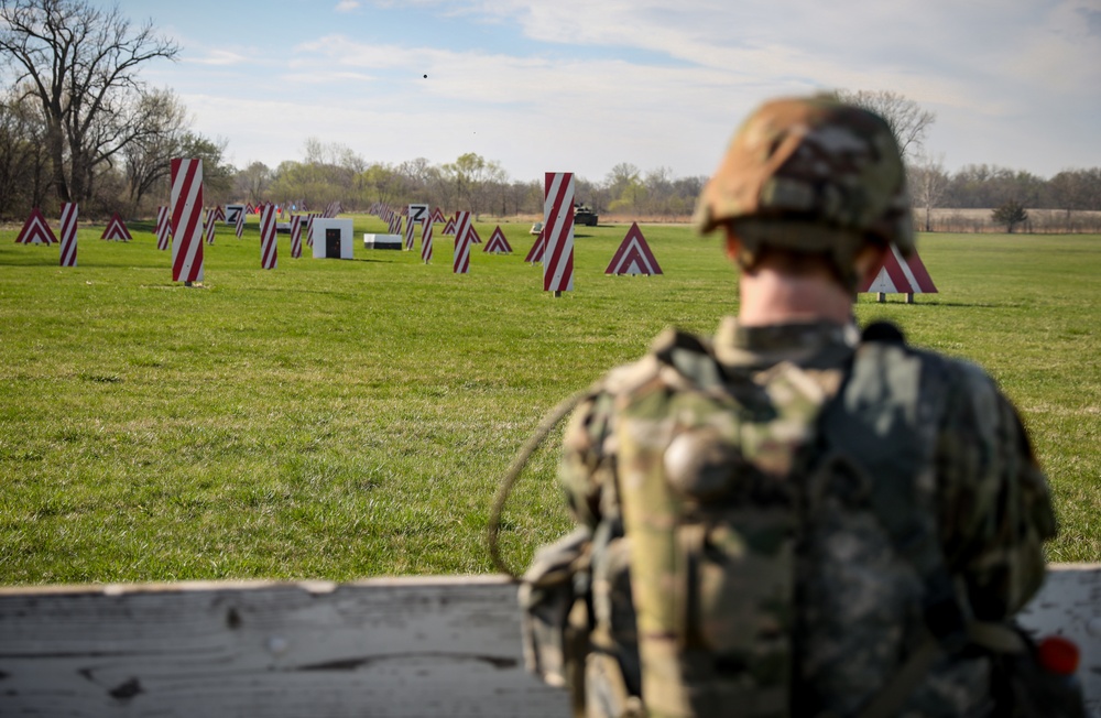 Iowa Best Warrior competitor fires grenade launcher