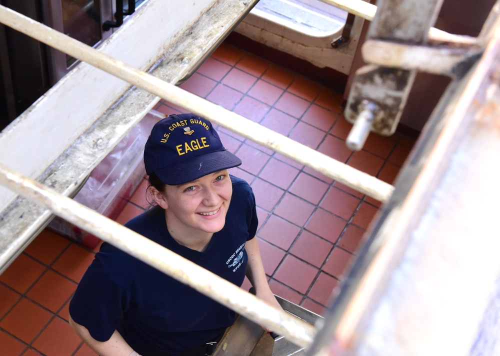 USCGC Eagle culinary specialists prepare cuisine while underway in the Atlantic Ocean