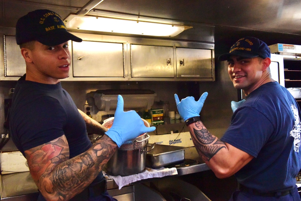 USCGC Eagle culinary specialists prepare cuisine while underway in the Atlantic Ocean