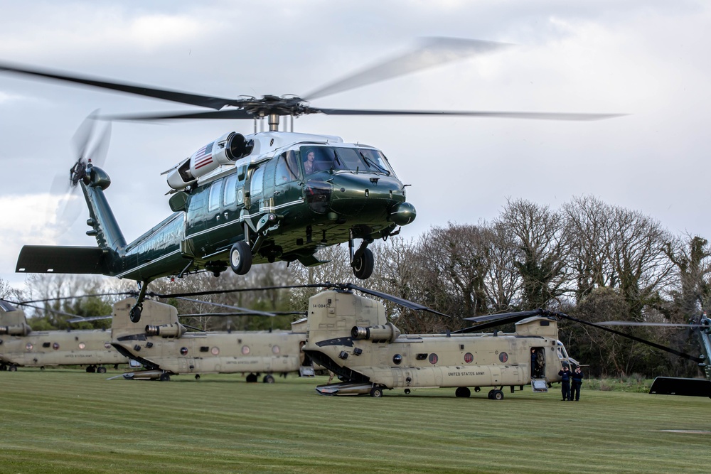 Marine One lands with President Joe Biden alongside CH-47 Chinooks