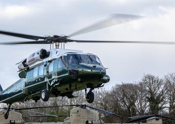Marine One lands with President Joe Biden alongside CH-47 Chinooks