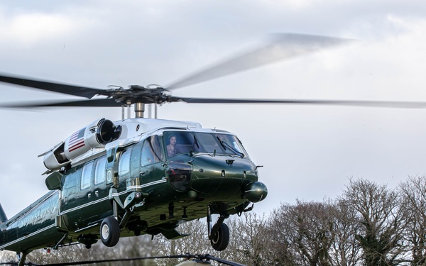 Marine One lands with President Joe Biden alongside CH-47 Chinooks