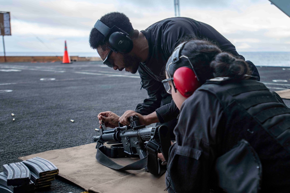 Sailor Instructs During Gun Shoot