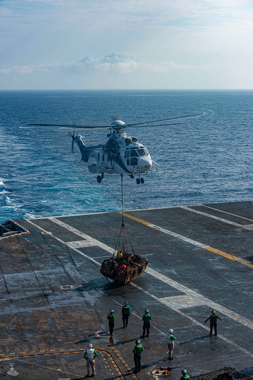 Helicopter Deposits Supplies On Flight Deck