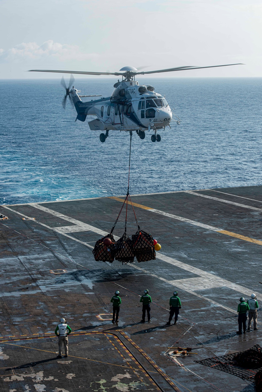 Helicopter Deposits Supplies On Flight Deck