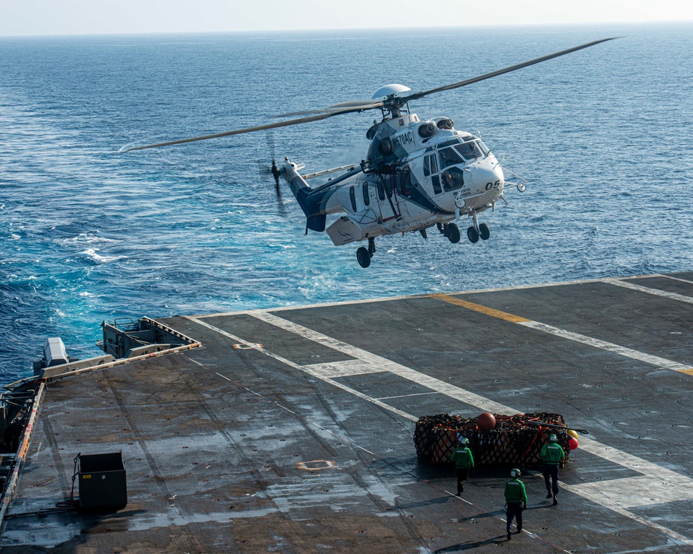 Sailors Process Cargo On The Flight Deck