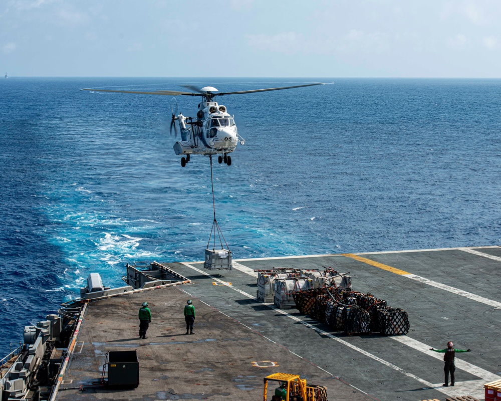 Helicopter Deposits Supplies On Flight Deck