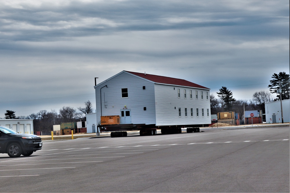 Contractors move third World War II-era barracks to new location