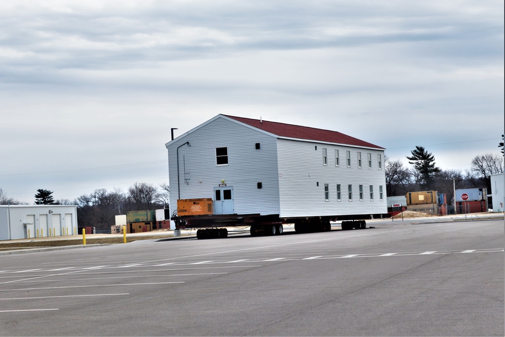 Contractors move third World War II-era barracks to new location