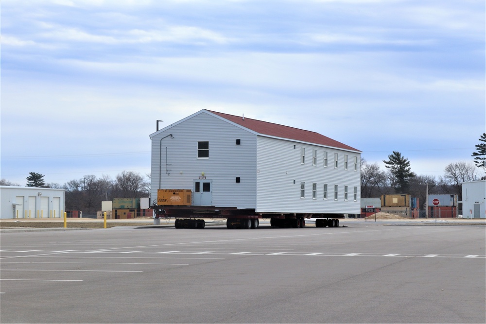 Contractors move third World War II-era barracks to new location