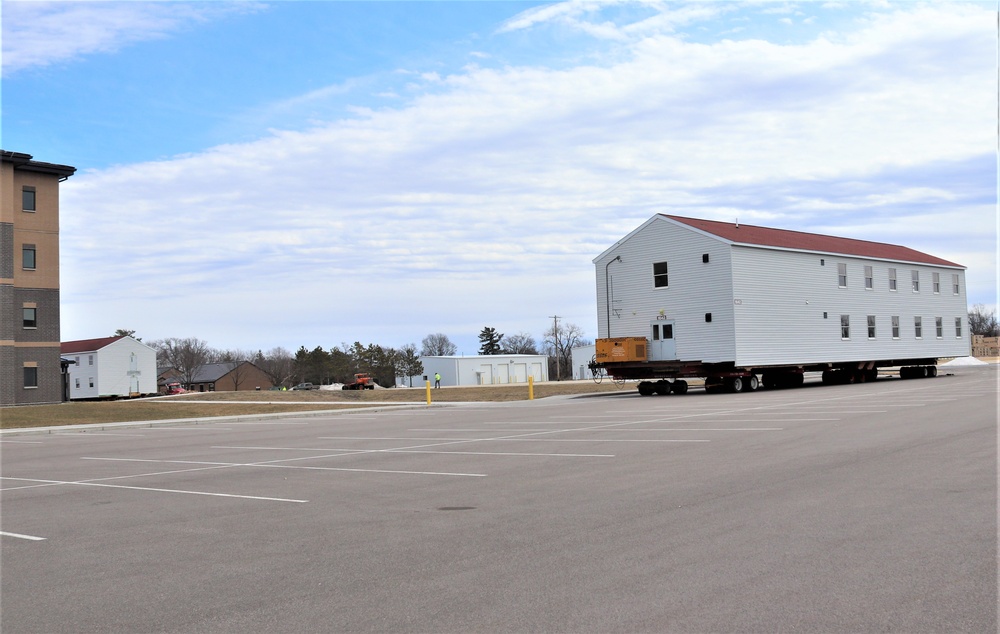 Contractors move third World War II-era barracks to new location