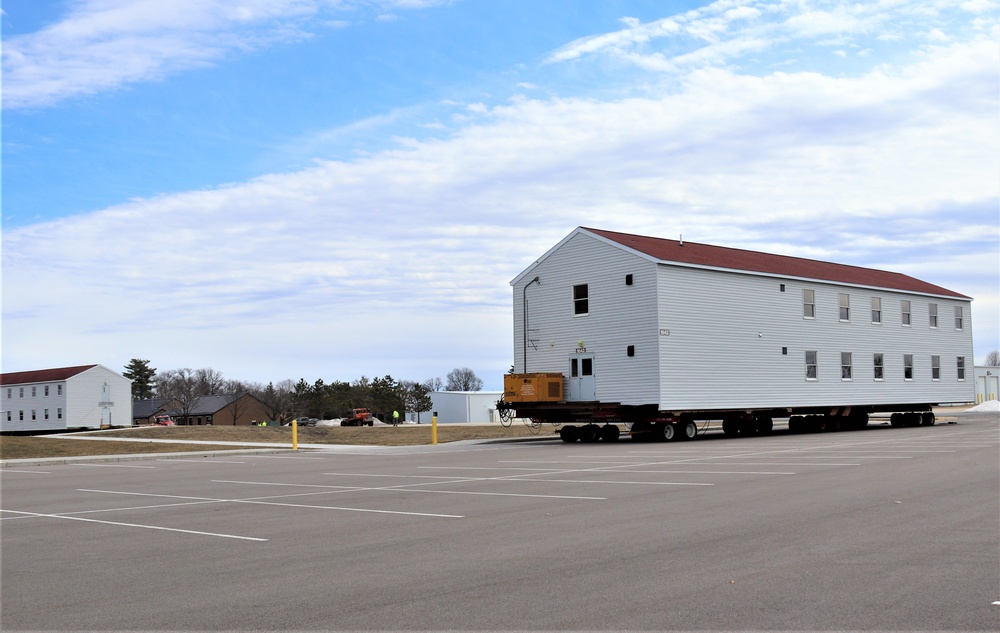 Contractors move third World War II-era barracks to new location